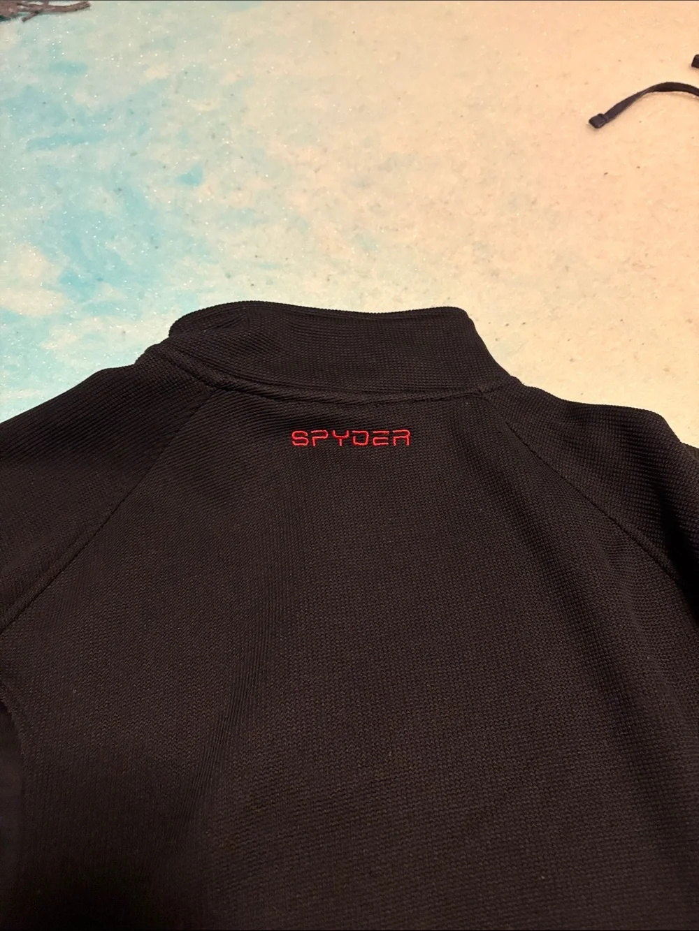 Spyder Men’s Black Half-Zip Sweater with Red Trim